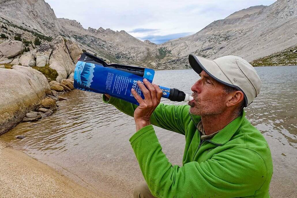 free three drink when thirsty hiker drinking from hydration bladder