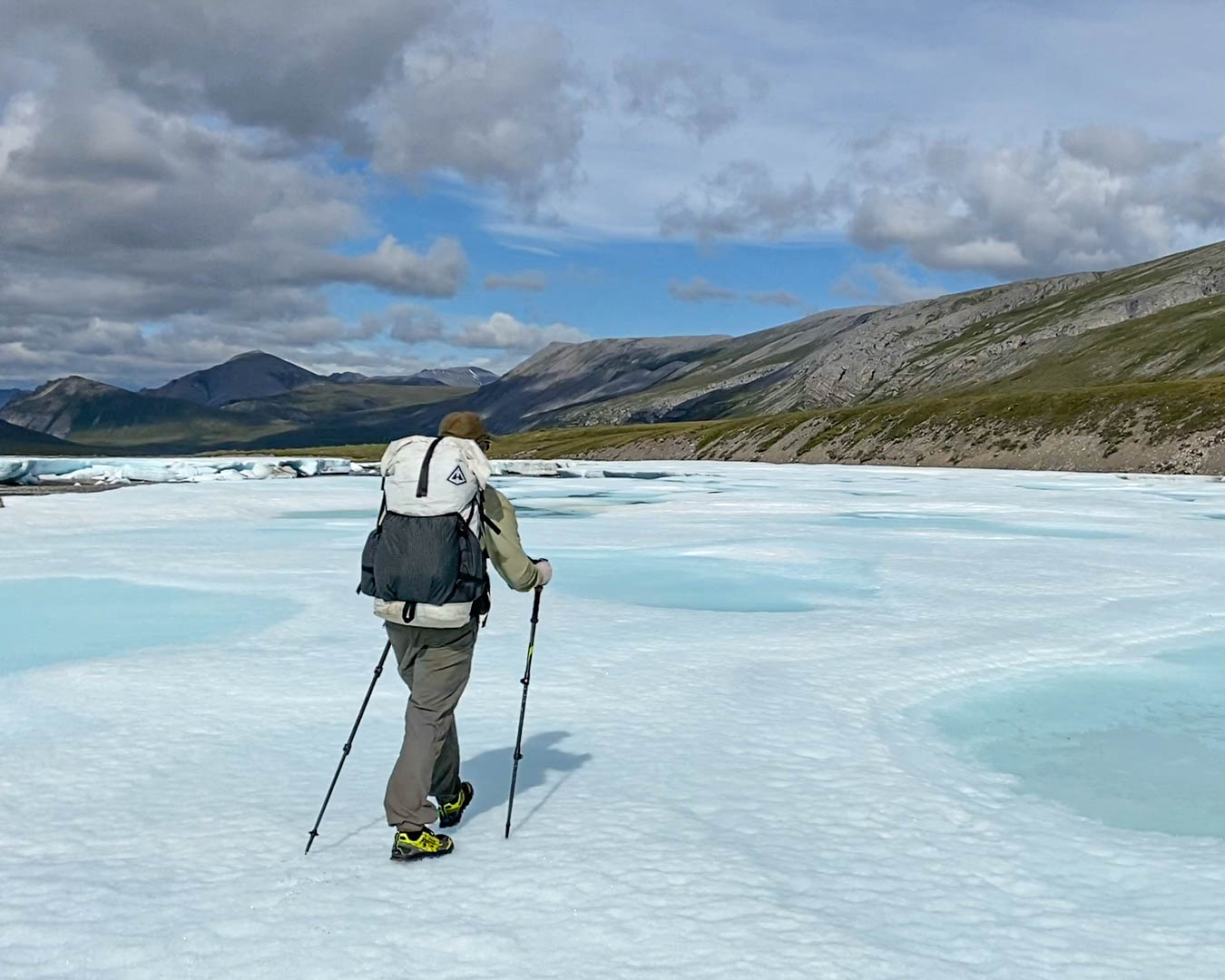 best trekking poles cover a hiker uses the trekking poles to cross a glacier