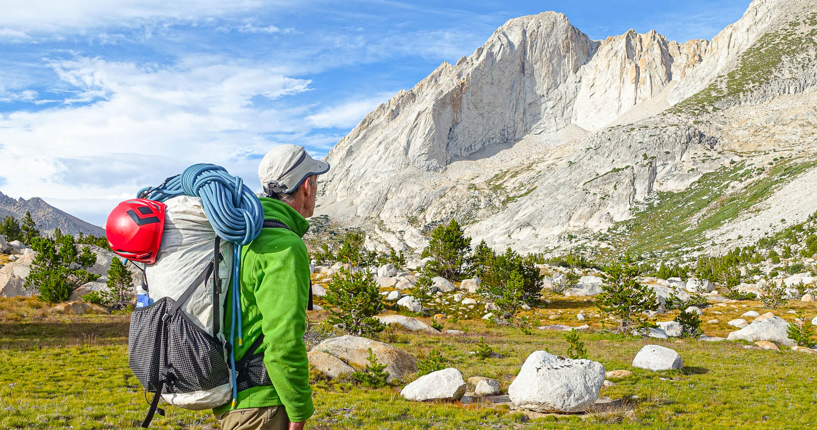 A hiker testing the best backpacking backpacks in the mountains