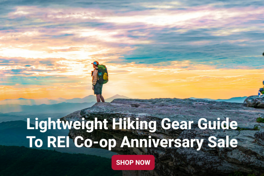 an ultralight backpacker watches the sunrise with gear from REI