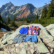 4 pairs of trail running shorts for hiking in front of a mountain