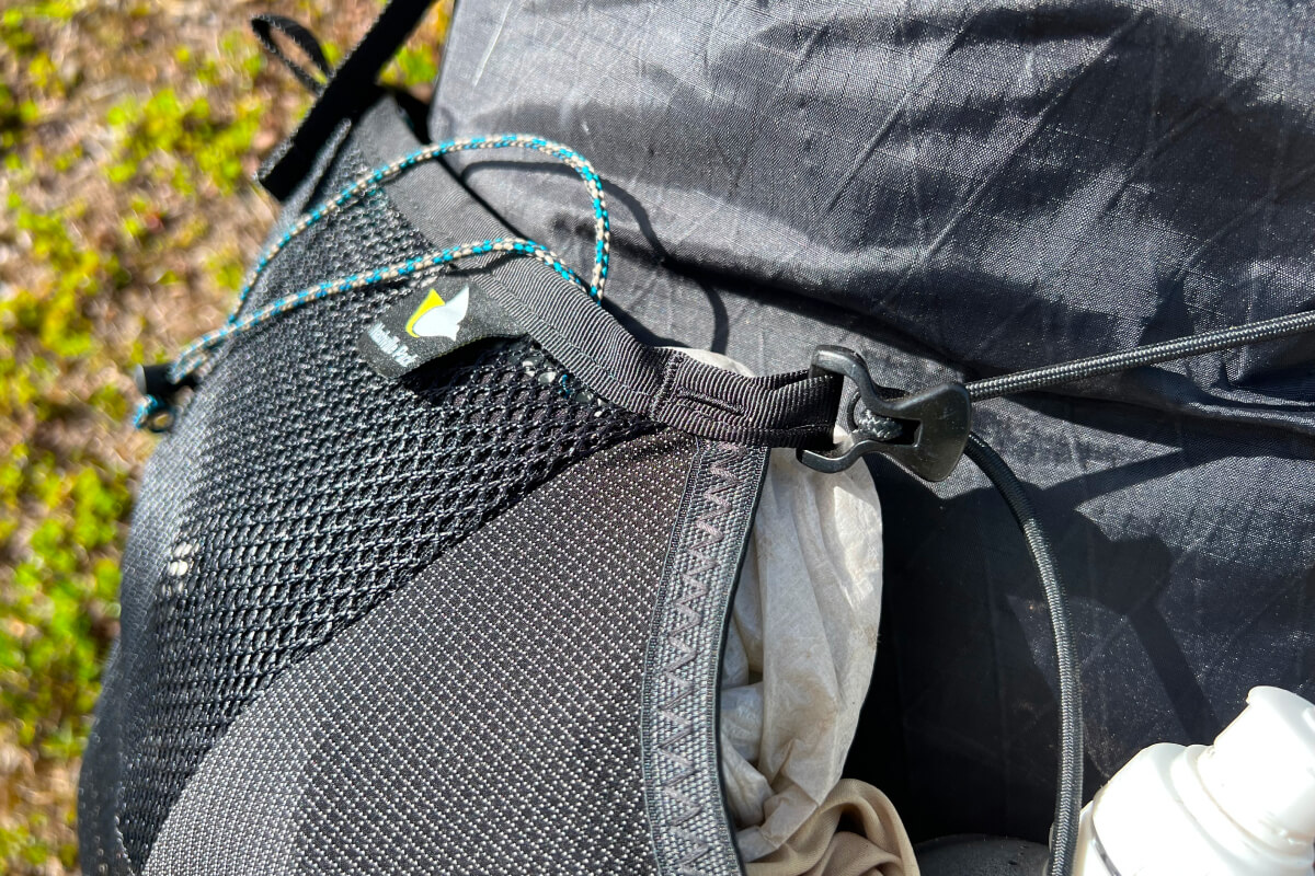 shock cord cinch for continuous front pocket
