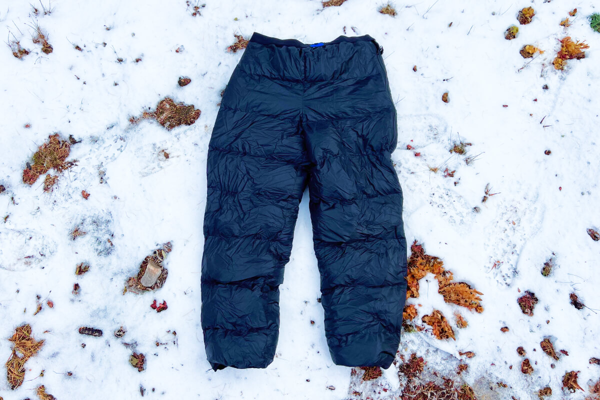 The Best Down Pants laying on the snow