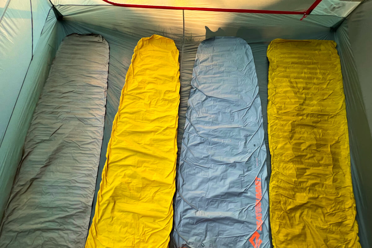 sleeping pads laid out on tent floor