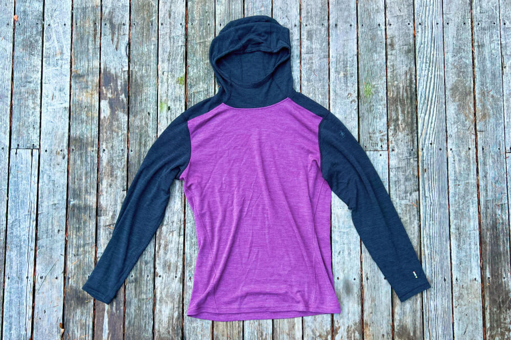 A merino wool hoodie hiking base layer