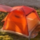 a small 2 person tent in the grass
