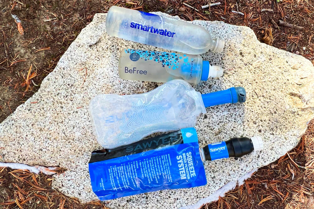Best Hiking Water Bottle for Ultralight Backpacking displayed on a rock