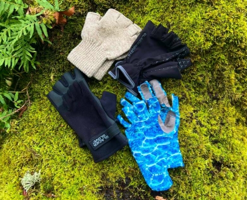 Wearing the Best Fingerless Ragg Gloves in front of moss