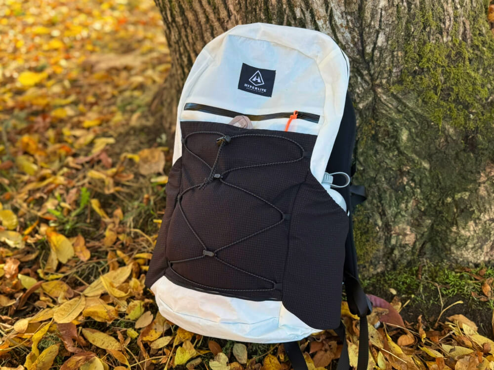 HMG Daybreak 22 Backpack against a tree