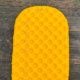 yellow sea to summit ultralight xr on wood background for review