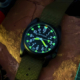 tritium watches glowing on a rock