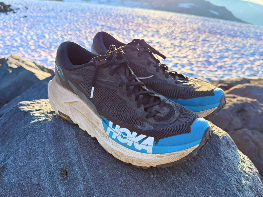 trail super shoes in front of a glacier trail super shoes in front of a glacier